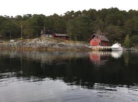 Flott hytte med panoramautsikt og privat strand，位于Stavang的酒店