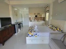 INATO SUITES Rm 1 1 queen bed and a pullout sofa bed