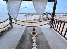 Rumahbatu beach cottage，位于瓜拉丁加奴的酒店