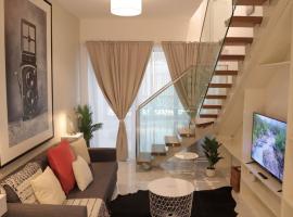 Desert Rose Apartment- Masdar City，位于Al Qurayyah的酒店