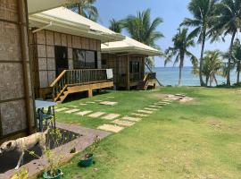 Villa Malinao Oceanview Resort - Deluxe bungalow，位于Burgos的带停车场的酒店