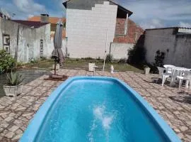CASA COM PISCINA EM BALNEÁRIO PINHAL RS