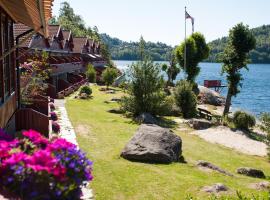 莫内斯费列森特公寓，位于曼达尔的自助式住宿