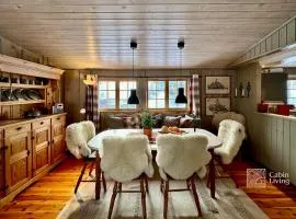 Family-friendly cabin at Sjusjøen with ski trails, sauna and fireplace