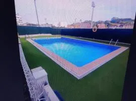 Apartamento luanco con garaje y piscina