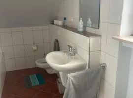 Chambre avec 3 lits