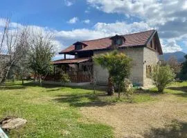 Detached stone house with access to a large garden near beach