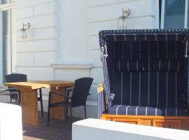 Zentrale Wohnung in der Villa Liewald mit Terrasse und Glasfaseranschluss，位于诺德奈的酒店