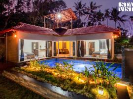 StayVista at Palm Tree Homes with Complimentary Breakfast, BBQ Grill and Pet-Friendly Home，位于瓦亚纳德的酒店