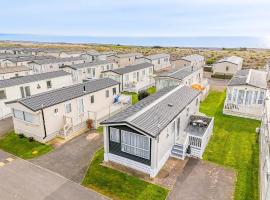 30 Bayside Cove Pevensey Bay Holiday Park，位于佩文西的酒店