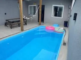 Casa com piscina ACONCHEGO no balneário de Shangri-lá