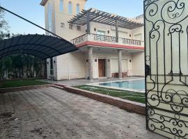 El dakroury king mariout villa，位于Naj‘ al Aḩwāl的酒店