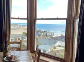 THE STONES a beautifully presented PRIVATE APARTMENT with far reaching VIEWS Over ST IVES HARBOUR and BAY and FREE ONSITE PARKING for LARGER GROUPS book along with our Connecting TWO SISTER APARTMENTS
