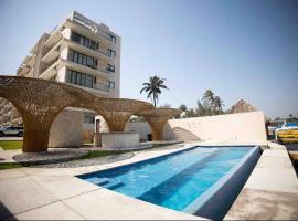 Departamento Puerta Al Mar，位于Conchal的酒店