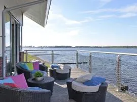 Waterfront penthouse with roof terrace and private jetty