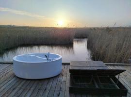 Pfahlbau Sunset II Toplage inklusive Elektroboot，位于拉斯特的酒店