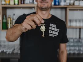 煤矿工小屋旅舍，位于朗伊尔城的酒店