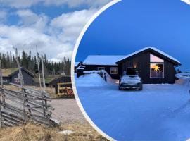 Koselig hytte - Trysilfjellet ski in og ski out 4 soverom, 2 bad, badstue, fiber bredbånd og Elbillader，位于特吕西尔的酒店
