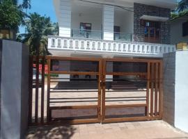 Whitehouse Homestay-Iqra Hospital Calicut，位于科泽科德的酒店