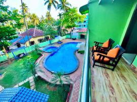 Hotel The Golden Shivam Resort - Big Swimming Pool Resort In Goa，位于Goa的酒店