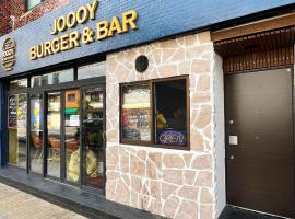 ゲストハウス JOOOY Hotel 奄美，位于奄美的酒店