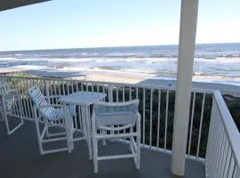 Large balcony with direct oceanfront views and access to complex pool