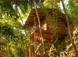 普瓦莎生态小屋酒店，位于迪加纳的住宿加早餐旅馆