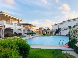 LOTUS Wellness Apartment - Resort Ginestre - Palau - Sardinia，位于帕劳的海滩短租房