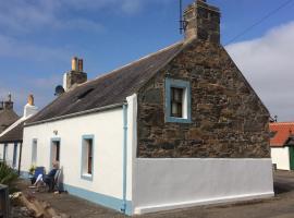 A cosy seaside cottage，位于库勒的酒店