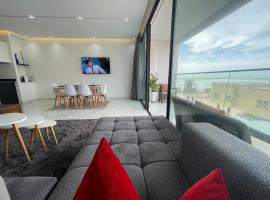 Nice new apartment with sea view，位于Mehdiya的酒店