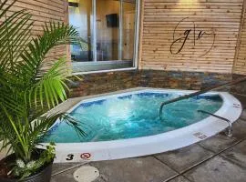 Cozy Villa 3 mins to Mohegan- Fully Stocked with King Bed & Fireplace- Jacuzzi, Saltwater Pools, Sauna