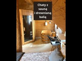 Chaty Świerkowe Wzgórze - drewniane domy z sauną i balią，位于卡尔帕奇的酒店