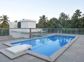 Ranghavi sands Apartment with Pool - near beach and Dabolim Airport，位于波戈马洛的公寓
