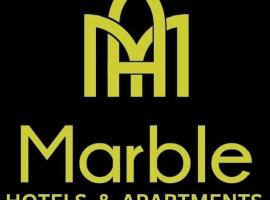 The Marble Hotels and Apartment，位于乌约的酒店