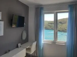 Apartment Noemi with a direct beach view