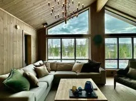 Idyllic cabin with great view right by the slopes