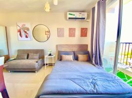 Cozy Condo near Airport with Pool and Ocean View，位于Suba的酒店