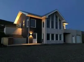 Villa in Akureyri with a hot tub and scenic view