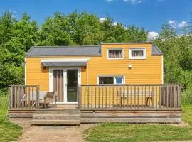 Yellow Tiny House with shared pool