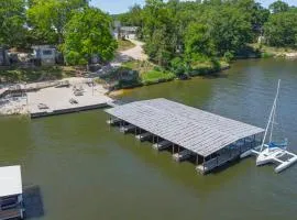 Lakeshore Fishing Cabin 5, dock, boat slip and firepit area