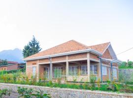 Future4Kids Kinigi Guest House By Isange paradise resort，位于Kinigi的带停车场的酒店