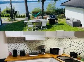 Nice Apartment with1 bedroom Separate living room with a sofa bed and a tiny kitchen a bathroom located in Nordstrand near by the Sea for 3 guests with a garden and grill with sea view just outside the apartment