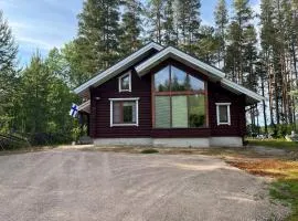 Holiday home with lake view and next to National Park