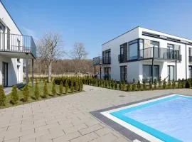 Paraiso Nadmorskie Apartamenty z Basenem i Parkingiem by Noclegi Renters