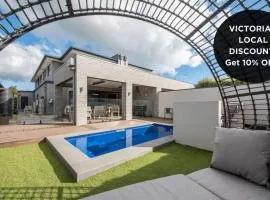 Casa de Praia luxe retreat with heated pool, walk to beach and golf