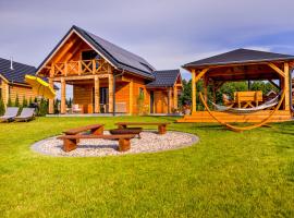 Przystanek MAZURY - domki nad jeziorem，位于Swiętajno的酒店
