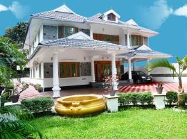 6 Large Bedrooms house at kottayam town #812!983!5682，位于戈德亚姆的酒店