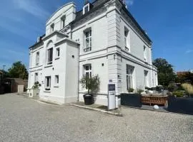 Hôtel Échappée en Baie - Parking privé gratuit dont forfaits bornes électriques réservable