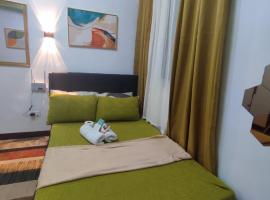 Happy Homestay at Fullerton Suites Condo near Nuvali and Tagaytay，位于锡朗的酒店