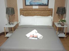 Daily Travellers Inn & Suites，位于Baclayon的酒店